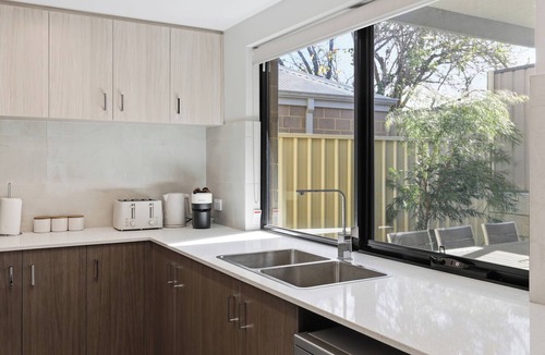 Bentley House | Newly built two-storey townhouse in the heart of Bentley — ideal for families, groups & corporate stays. Modern interiors, gourmet kitchen, private alfresco & a Nespresso on us.
