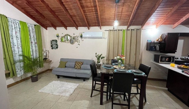 Charming gated 2-bedroom house with WiFi, AC, and spacious yard