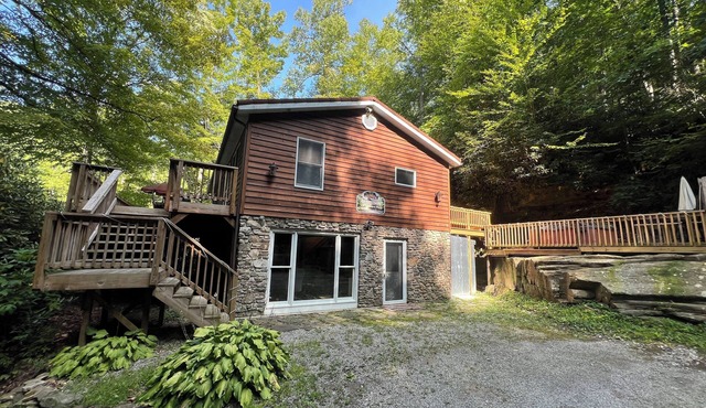 Charming riverfront home with beautiful views, hot tub and game room. Fishing!