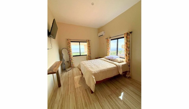 Dream Suite is on the third-floor with a queen bed and sea view. A peaceful escape for rest and reflection!