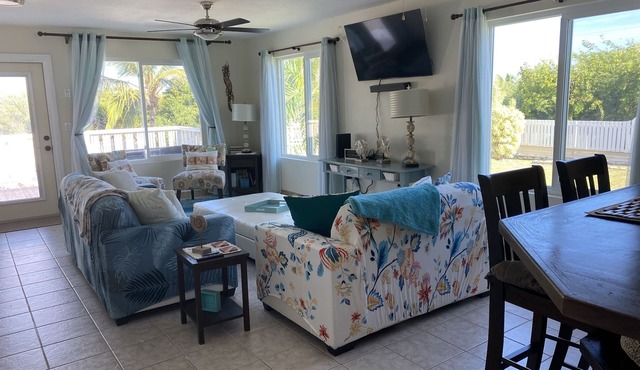 Modern vacation home with private yard, steps to the beach and centrally located