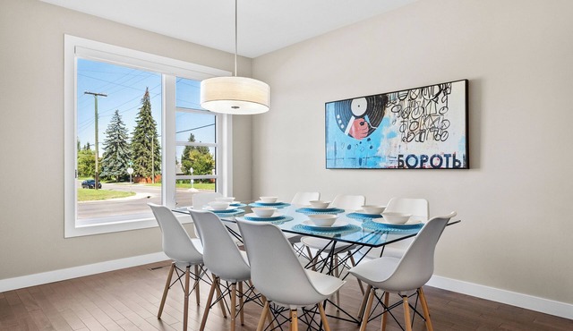 Spacious Central 4BR Duplex with 2 Car Garage & Downtown View from Rooftop Patio