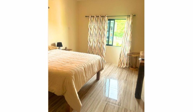 Stylish suite with a queen bed and modern neutral tones. A refined retreat designed for comfort and relaxation!